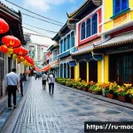 Home 19 마카오의 포르투갈 식민지배 - A vibrant street scene in Macau's historic old town, showcasing a harmonious blend of Portuguese col...